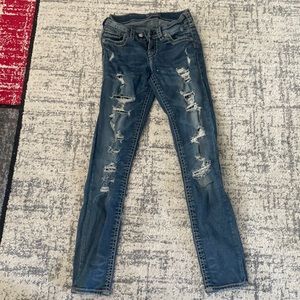 Silver jeans with lace and jean inside the tears